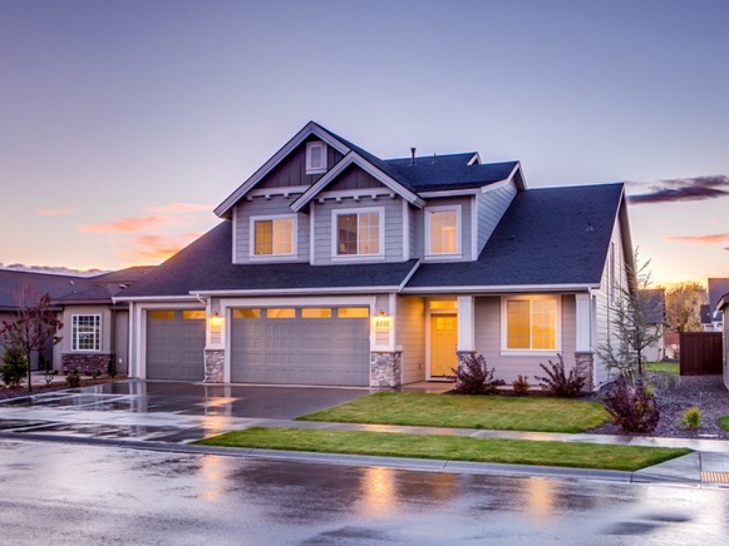 blue single-family home with two-car garage